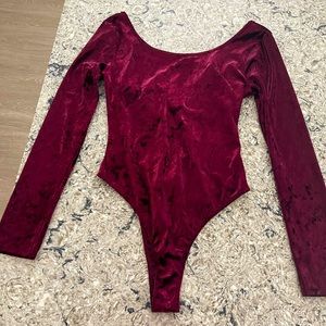 Lush velvet burgundy body suit. Women’s size medium. New with tags.